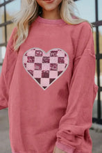 Pink corduroy heart sweater with checkered plaid and frayed edges