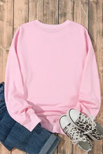 Pink bow graphic round neck long sleeve sweatshirt with leopard sneakers and jeans