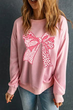 Pink long sleeve sweatshirt with bow graphic round neck design
