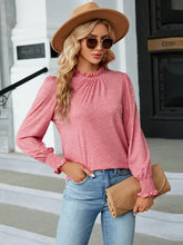 Pink long sleeve blouse with ruffled mock neck flounce and smocked cuffs