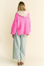 Neon pink long sleeve cardigan with hood and textured sleeves