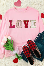 Pink love patch round neck dropped shoulder sequin sweatshirt with jeans and sneakers