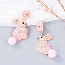 Pink synthetic pearl alloy rabbit dangle earrings with pom-pom tails