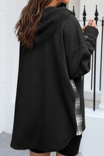 Black textured oversized fleece hoodie with pink plaid pocket and drawstring hood