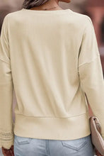 Pink ribbed v neck sweater with beige lace trim detailing