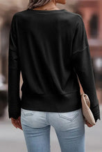 Pink ribbed V neck sweater with lace trim
