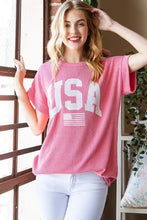 Pink short sleeve ribbed top with bold USA graphic and flag