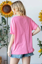 Pink short sleeve t-shirt with ruffled leopard star patch over denim shorts