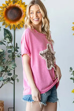Pink short sleeve t-shirt with bold leopard print ruffled star patch