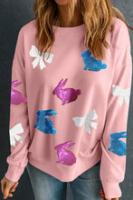Pink sweatshirt with bunny sequin accents and long sleeves