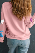 Pink cotton sweatshirt with butterfly, dragonfly, and bunny sequin accents