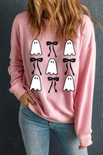 Pink sweatshirt with ghost print and black bows on front