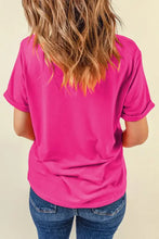Hot pink oversized pink t-shirt with cowboy boot graphic and basic style