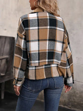 Plaid flannel shirt with brown, beige, black checks and long sleeve length