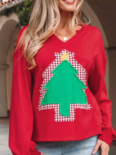 Red long-sleeved sweatshirt with green christmas tree patch and checkered background machine wash cold recommended