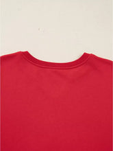 Red crewneck sweatshirt with ribbed neckline featuring plaid frayed double christmas tree patches, machine wash cold
