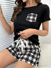 Black short-sleeved t-shirt with checkered pocket featuring red hearts in plaid heart lounge set suitable for tumble dry