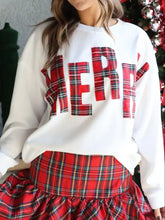 White sweatshirt with bold red plaid merry lettering paired with red green tartan skirt machine wash cold
