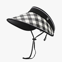 Black and white plaid visor on plaid natural grass adjustable sun hat