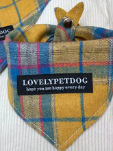 Plaid pet scarf with lovelypetdog label and happy every day text