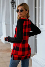 Red and black plaid round neck long sleeve t-shirt with black raglan sleeves