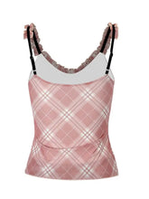 Pink plaid ruffle trim cami with adjustable black shoulder clips and ruffled straps for stylish layering