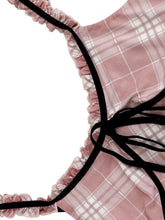 Pink plaid ruffle trim cami with black ribbon straps and ruffled edges in a lightweight lingerie top design
