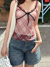 Pink and white plaid ruffle trim cami with black lace trim and bow at neckline for stylish layering