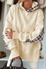 Cream-colored long sleeve hoodie machine wash friendly with black and white plaid accents on hood sleeves and cuffs