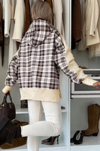 Plaid side slit long sleeve hoodie with black and white plaid accents and cream sleeves is machine wash friendly