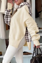 Cream-colored oversized long sleeve hoodie with plaid accents on sleeves and hood worn over white leggings machine wash safe