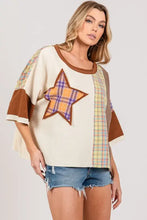 Plaid star patch round neck t-shirt for women with fringe details on cream background