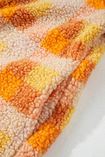 Orange and pink chevron blanket in plaid teddy bear coat with pink hood