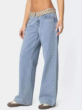 Light-wash denim wide leg jeans featuring a plaid trim wide waistband with plaid fabric detailing