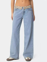 Light-wash denim flare jeans featuring a plaid trim wide waistband for a stylish plaid trim wide leg look