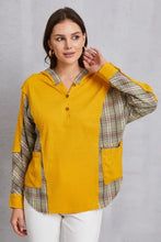 Mustard yellow women’s half button hoodie with plaid sleeves