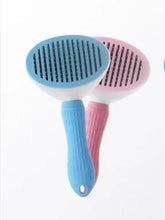 Blue pink slicker brush with retractable silicone bristles removes loose fur