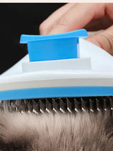 Blue and white slicker brush with retractable metal bristles for loose fur