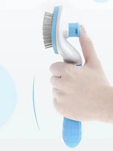 Blue and white slicker brush with wire bristles removes loose fur