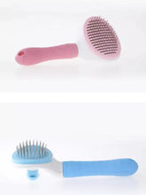 Pink and blue slicker brush with retractable metal bristles for loose fur