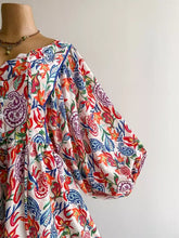 Plus size boho floral print off-shoulder romper in vibrant paisley pattern