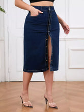 Dark blue plus size denim skirt with front button closure, high waist, high slit, and slightly stretchy fabric
