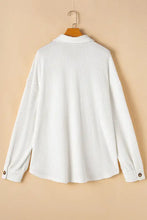 Plus size white ribbed cotton blouse with buttoned cuffs and collar
