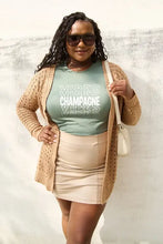 Plus size woman in champagne vibes short sleeve t-shirt and open knit cardigan