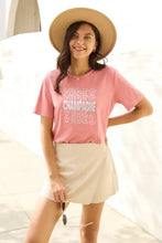 Plus size champagne vibes short sleeve pink tee with tan hat and beige skirt
