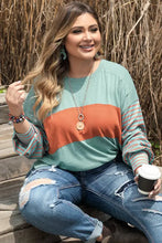 Plus size color block dropped shoulder long-sleeve top with jeans and coffee