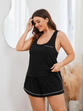 Black plus size racerback tank and shorts pajama set with white contrast piping perfect for comfortable lounging