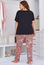 Plus size round neck black short sleeve tee paired with coral floral pants lounge set for comfortable wear