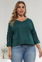 Plus size dark teal V-neck top with lattice sleeve cutout