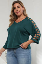 Plus size dark teal V-neck top with lattice sleeve cutout
